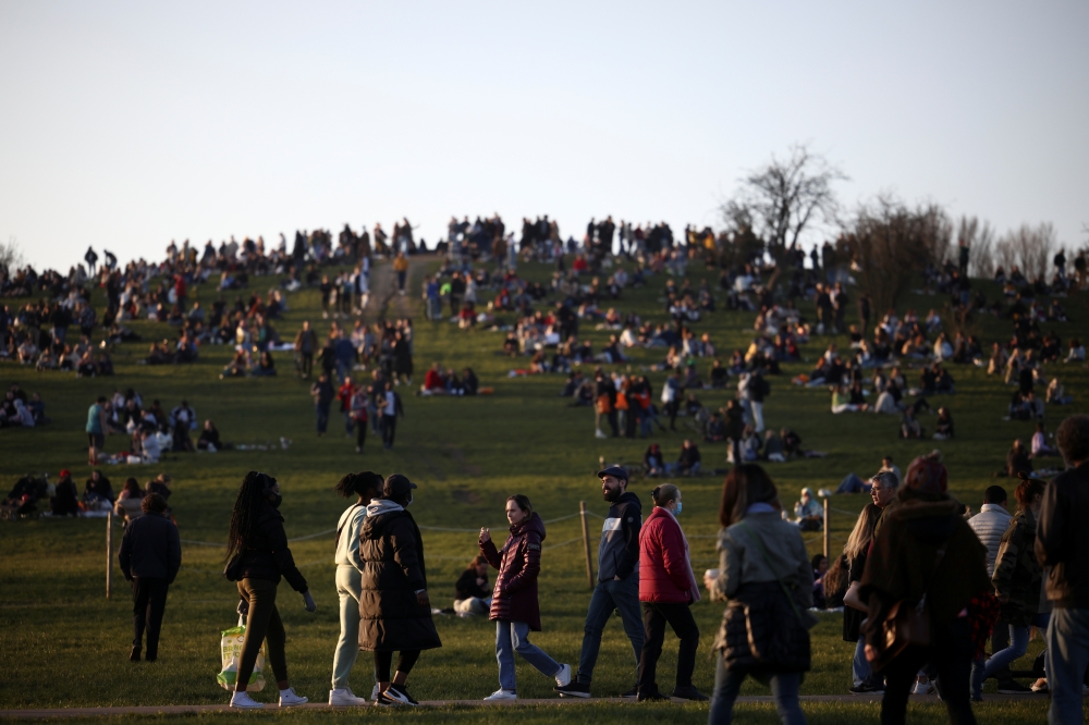 People visit Primrose Hill, amid the coronavirus disease (COVID-19) outbreak, in London, Britain, February 27, 2021. REUTERS/Henry Nicholls
