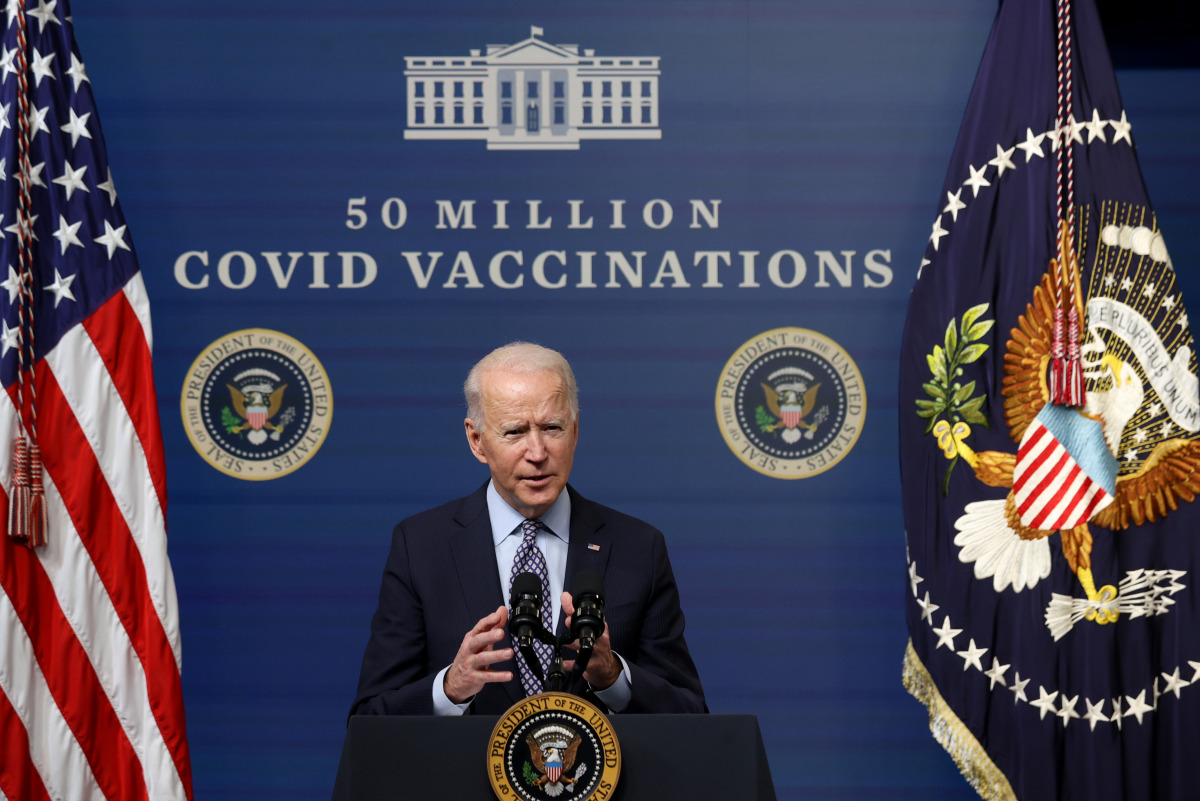 U.S. President Joe Biden delivers remarks as he commemorates the 50 millionth coronavirus disease (COVID-19) vaccination with a number of vaccine recipients in the South Court Auditorium at the White House in Washington, U.S., February 25, 2021. REUTERS/J
