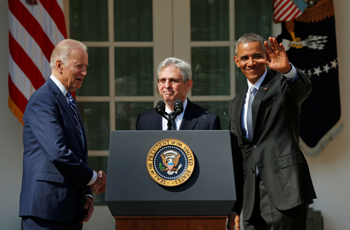 FILE PHOTO: Judge Merrick Garland (C) shakes hands with Vice-President Joe Biden (L) as President Barack Obama waves after Obama announced Garland as his nominee to the U.S. Supreme Court in the Rose Garden of the White House in Washington D.C., March 16,