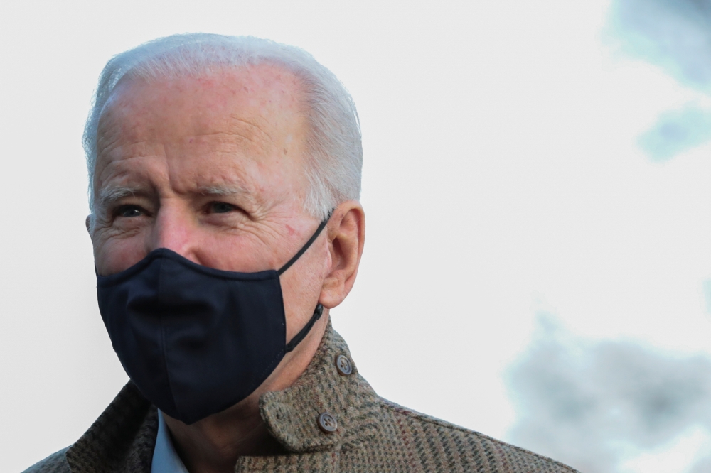 U.S. President Joe Biden talks to reporters on the South Lawn of the White House, in Washington, U.S., March 14, 2021. REUTERS/Cheriss May