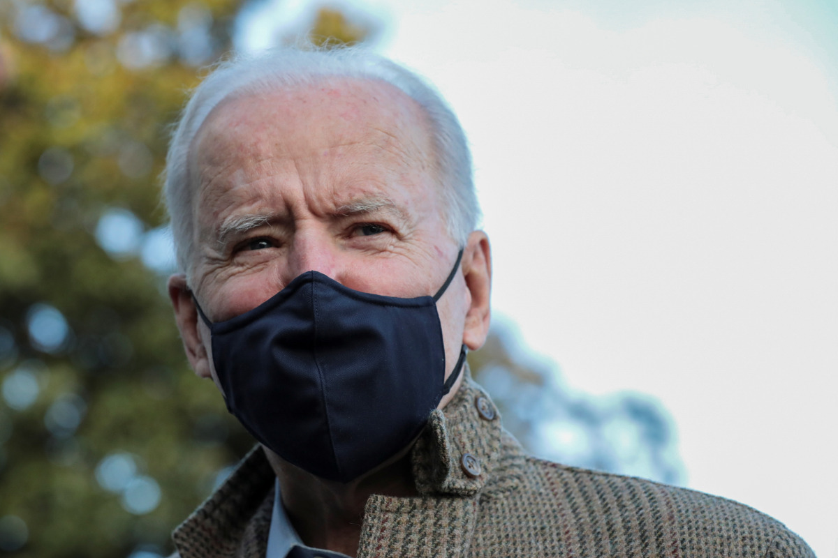 U.S. President Joe Biden talks to reporters on the South Lawn of the White House, in Washington, U.S., March 14, 2021. REUTERS/Cheriss May

