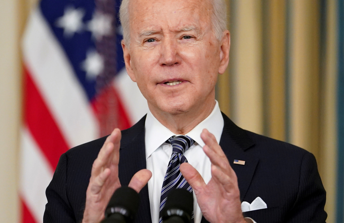 FILE PHOTO: U.S. President Joe Biden speaks about the implementation of the American Rescue Plan in the State Dining Room at the White House in Washington, U.S., March 15, 2021. REUTERS/Kevin Lamarque/File Photo
