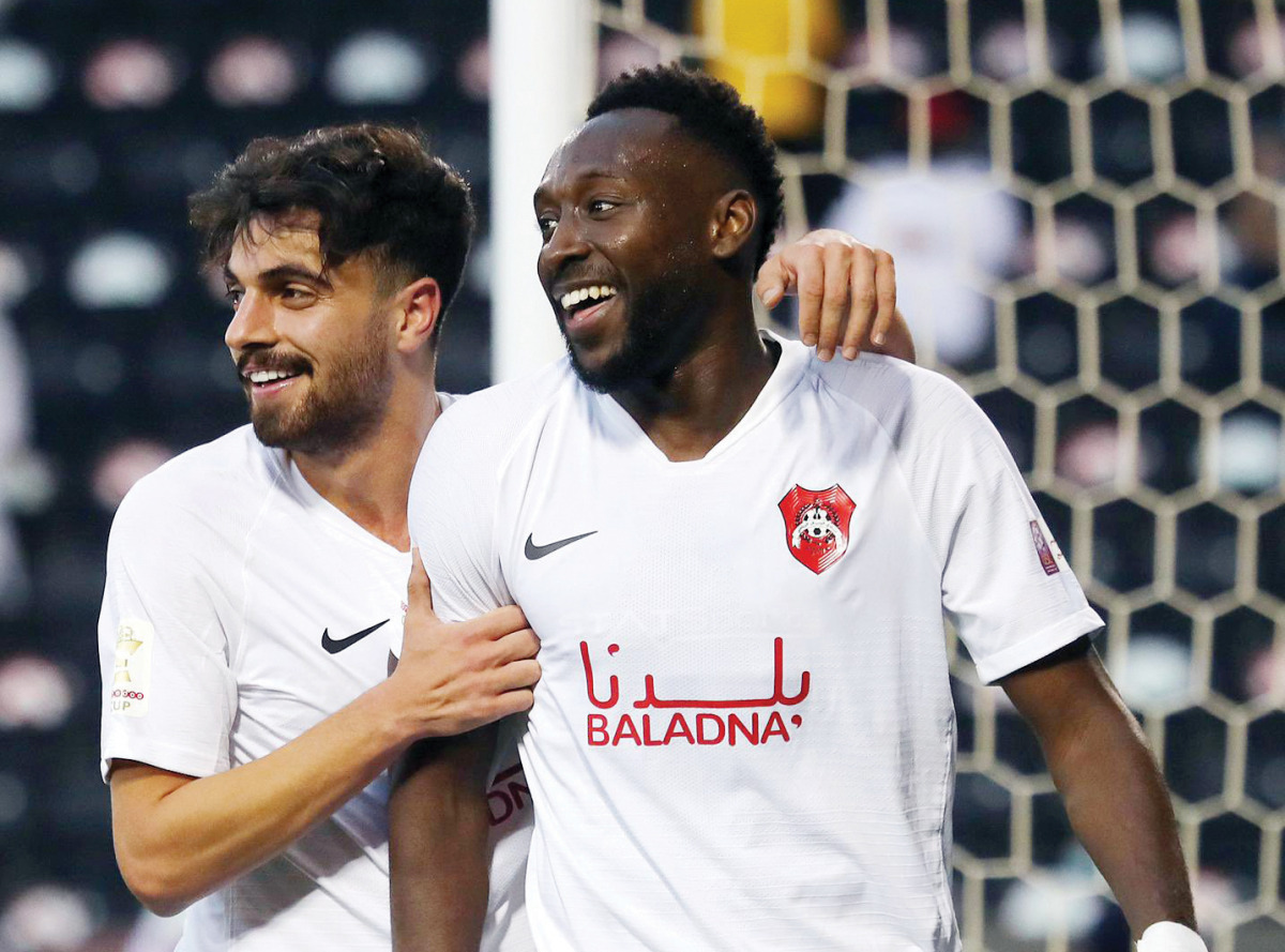 Al Rayyan's Yohan Boli is congratulated by team-mate Ibrahim Abdelhalim Masoud after the Ivorian scored a goal against Al Gharafa during yesterday's Ooredoo Cup semi-final.