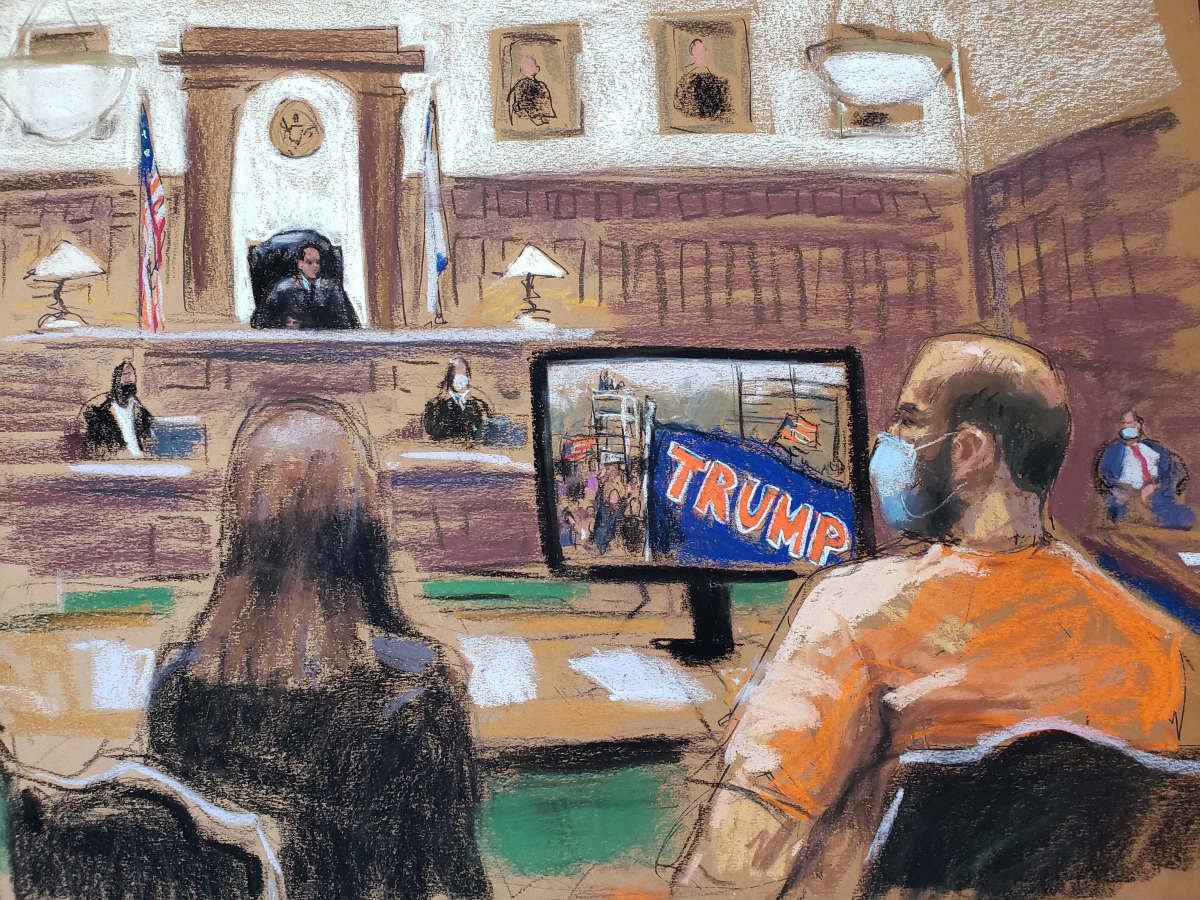 George Pierre Tanios watches as a video of the January 6th storming of the U.S. Capitol in Washington is shown during his hearing on charges of pepper-spraying Capitol police officers, in Clarksburg, West Virginia, U.S. March 22, 2021, in this courtroom s