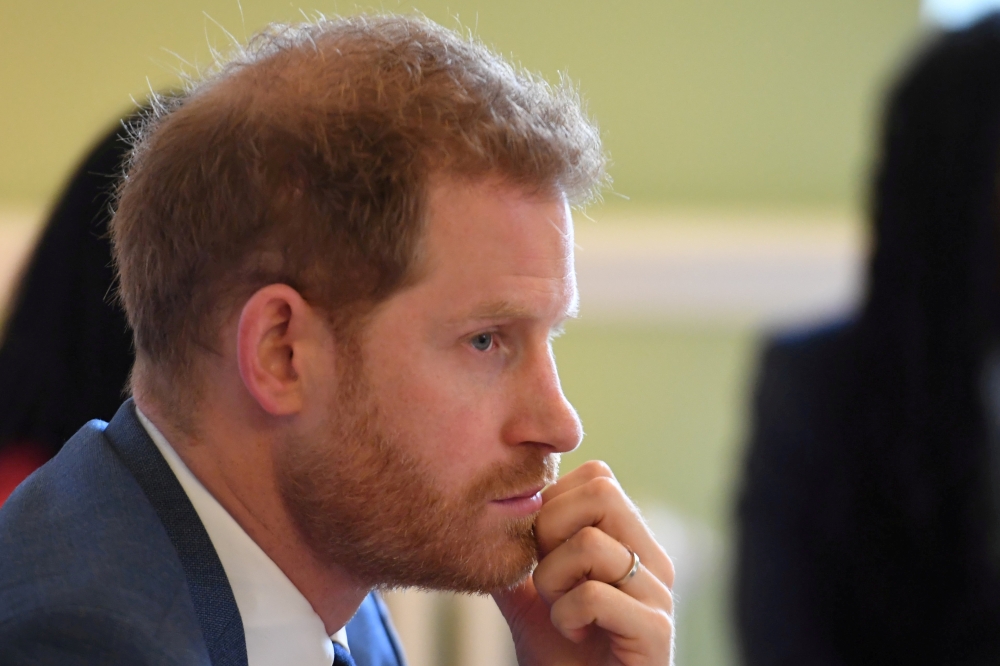 FILE PHOTO: Britain's Prince Harry, Duke of Sussex, attends a roundtable discussion on gender equality with The Queen's Commonwealth Trust (QCT) and One Young World at Windsor Castle, Windsor, Britain October 25, 2019. Jeremy Selwyn/Pool via REUTERS/File 