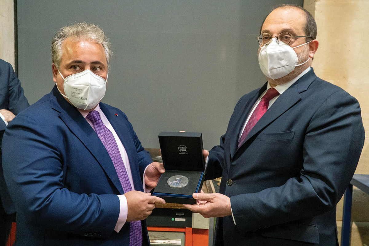 Ambassador of Qatar to the French Republic, H E Sheikh Ali bin Jassim Al Thani (left), receiving the medal in Paris.