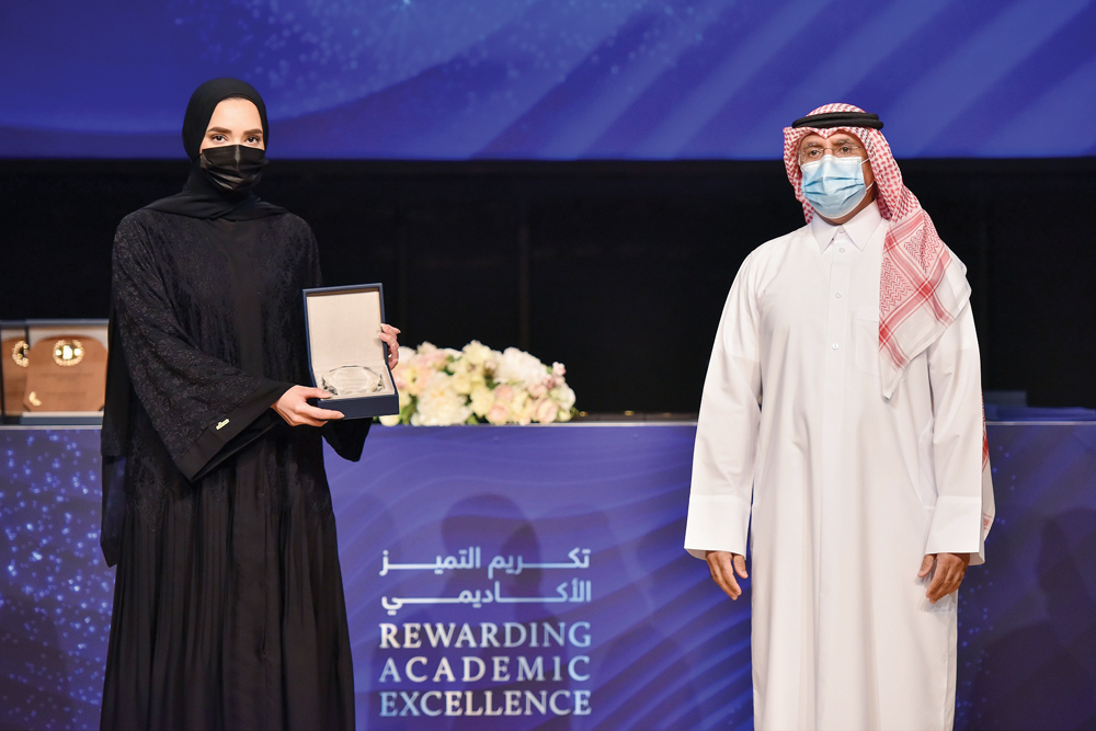 CNA-Q President Dr. Salem Al Naemi with one of the best students during the ceremony.
