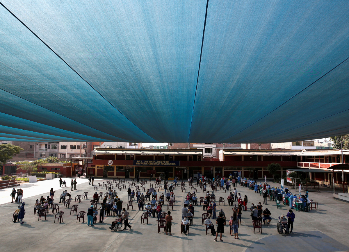 FILE PHOTO: Senior citizens wait to receive a dose of the Pfizer-BioNTech coronavirus disease (COVID-19) vaccine in Lima, Peru March 23, 2021. REUTERS/Sebastian Castaneda/File Photo
