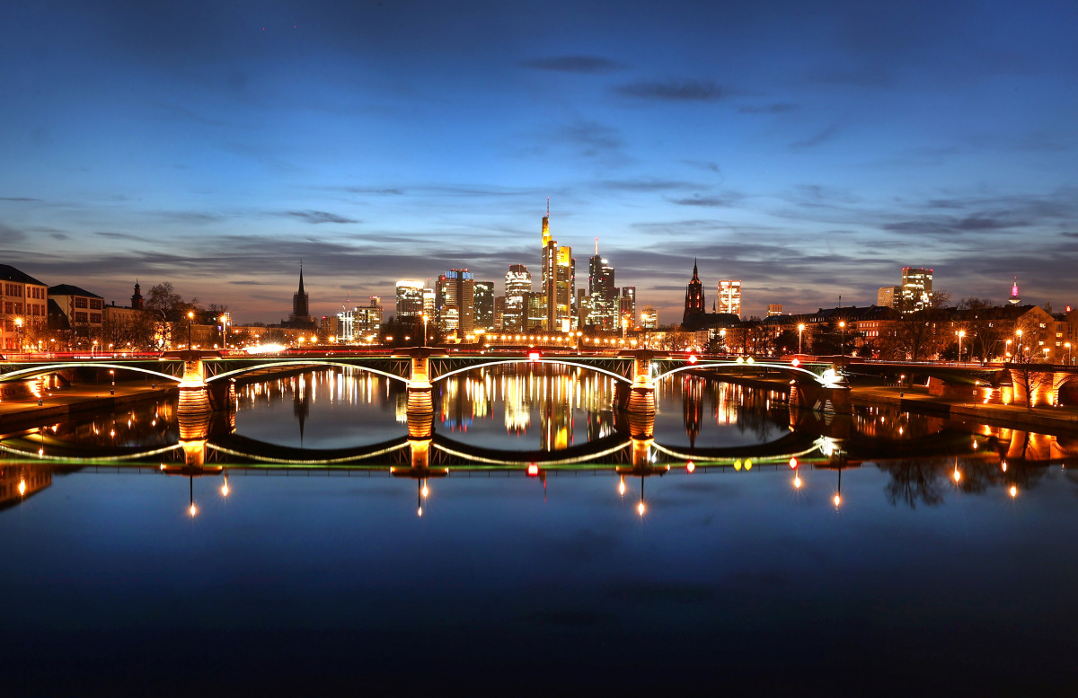 The sun sets over the skyline after the first warm spring day as the spread of the coronavirus disease (COVID-19) continues in Frankfurt, Germany, March 24, 2021. REUTERS/Kai Pfaffenbach
