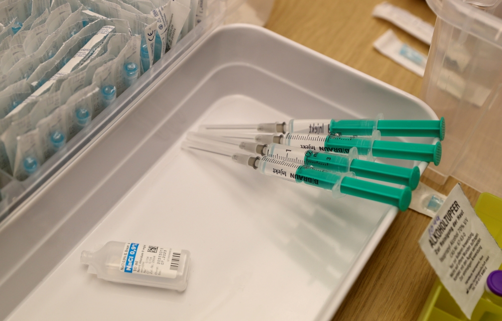 Syringes containing Pfizer-BioNTech coronavirus disease (COVID-19) vaccine are seen at the Impfzentrum Basel Stadt vaccination center, at the Congress Center of the Messe Basel fairground in Basel in Basel, Switzerland March 18, 2021. REUTERS/Arnd Wiegman