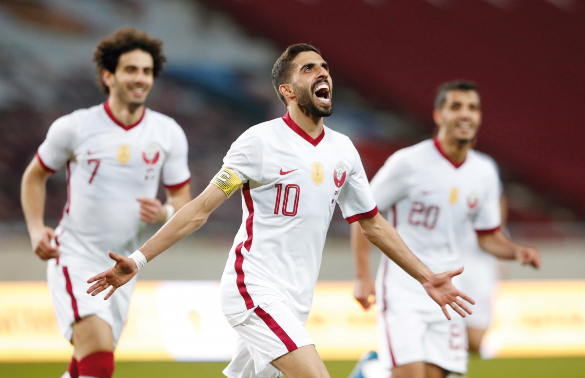 Qatar’s  Hassan Al Haydos (centre) celebrates after scoring their first goal against Azerbaijan at Nagyerdei Stadionin Debrecen, Hungary yesterday. 