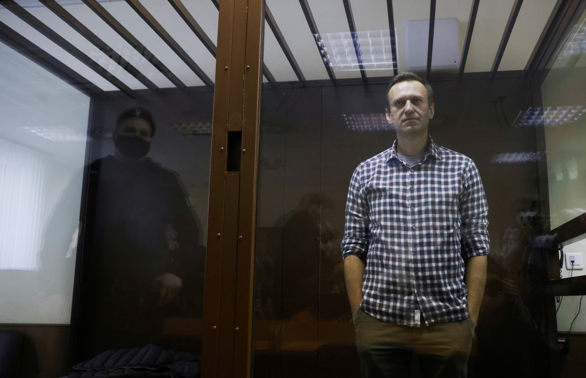 FILE PHOTO: Russian opposition politician Alexei Navalny attends a hearing to consider an appeal against an earlier court decision to change his suspended sentence to a real prison term, in Moscow, Russia February 20, 2021. REUTERS/Maxim Shemetov/File Pho