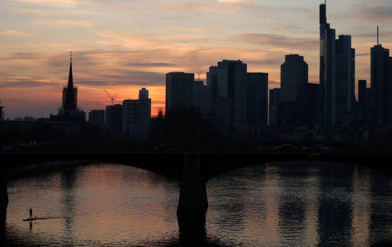 A stand-up paddler enjoys the first warm spring evening as the spread of the coronavirus disease (COVID-19) continues in Frankfurt, Germany, March 24, 2021. REUTERS/Kai Pfaffenbach