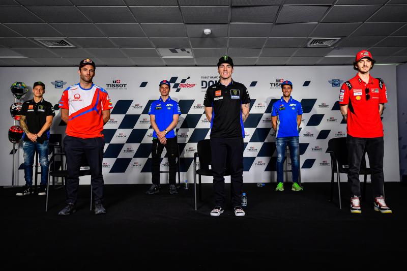 Maverick Vinales (centre, front) along with Johann Zarco, Francesco Bagnaia, defending world champion Joan Mir, Fabio Quartararo and Alex Rins, poses from a picture after a press conference at Losail International Circuit yesterday. RIGHT: Vinales gesture