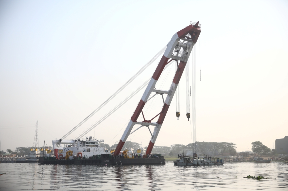 A rescue ship is seen at the site where several people died after a ferry collided with a cargo vessel and sank on Sunday in the Shitalakhsyaa River in Narayanganj, Bangladesh, April 5, 2021. Reuters/Mohammad Ponir Hossain