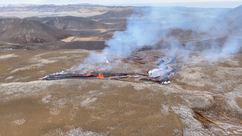 Lava erupts from a new fissure at the volcanic site near Fagradalsfjall, Reykjanes Peninsula,Iceland, April 5, 2021, in this screengrab obtained from a social media video. Content filmed April 5, 2021. Icelandic Coast Guard via REUTERS