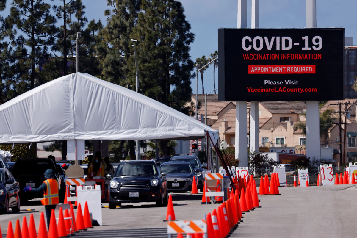 FILE PHOTO: A large vaccination site is shown as people with preexisting health conditions are granted access to a vaccination during the outbreak of the coronavirus disease (COVID-19) in Inglewood, California, U.S., March 15, 2021. REUTERS/Mike Blake/Fil