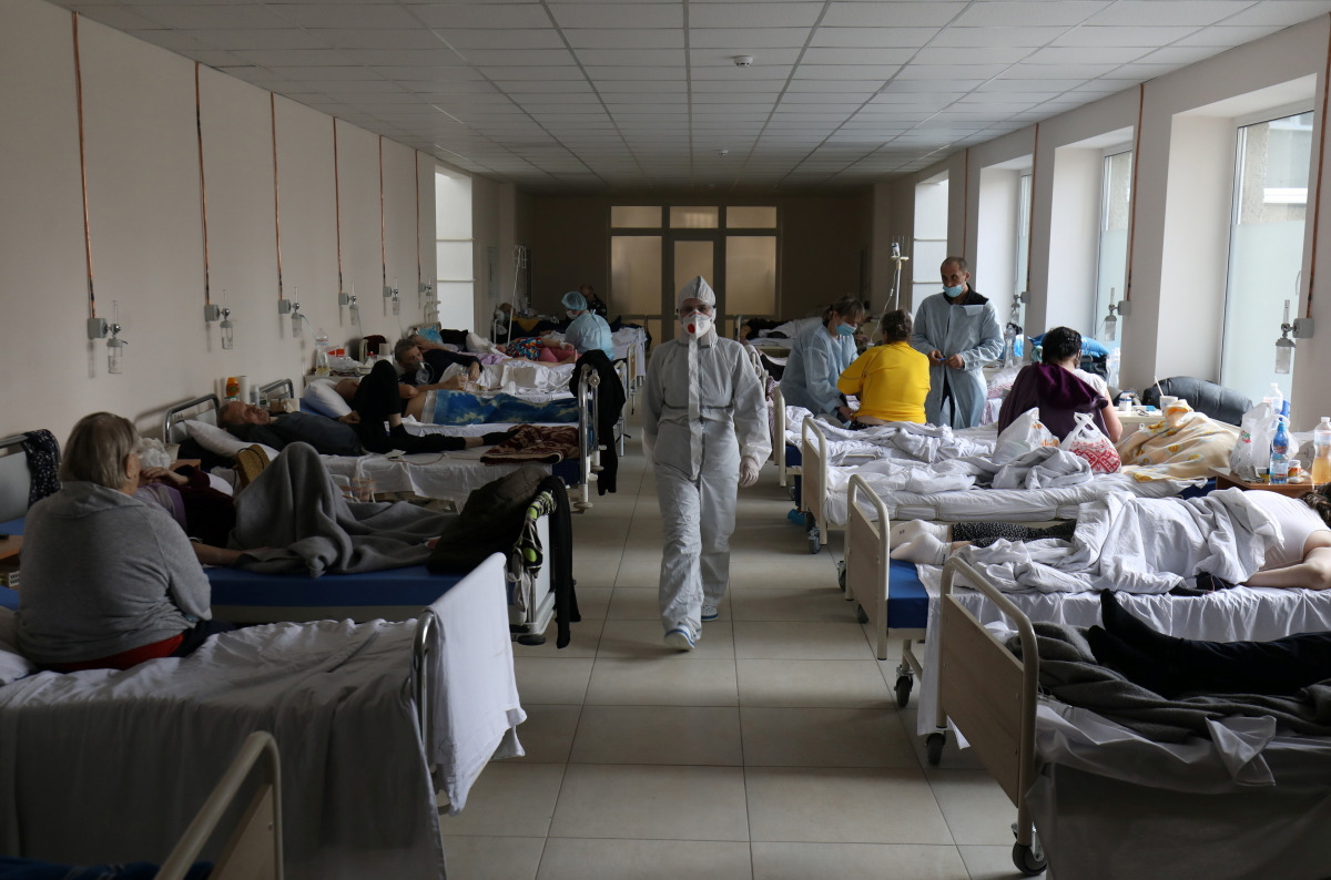 A medical specialist wearing personal protective equipment (PPE) walks in the medical college building which was converted into the coronavirus disease (COVID-19) ward of a local hospital in Lviv, Ukraine April 1, 2021. REUTERS/Roman Baluk
