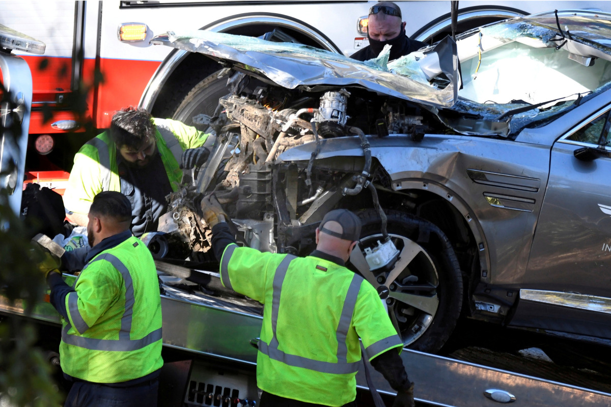 FILE PHOTO: The vehicle of golfer Tiger Woods, who was rushed to hospital after suffering multiple injuries, is loaded onto a recovery truck after being involved in a single-vehicle accident in Los Angeles, California, U.S. February 23, 2021. REUTERS/Gene