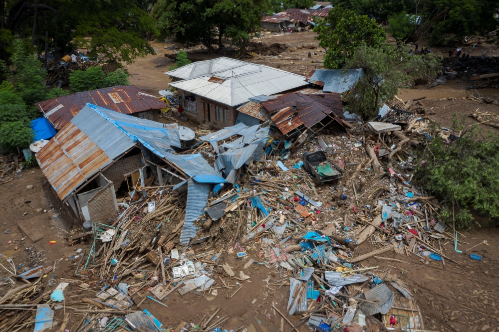 An aerial picture shows damaged houses following flash floods triggered by tropical cyclone Seroja in East Flores, East Nusa Tenggara province, Indonesia April 7, 2021, in this photo taken by Antara Foto/Aditya Pradana Putra via Reuters