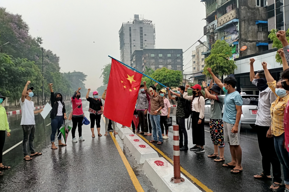 File photo: Anti-coup protesters hold a Chinese flag before burning it down during a demonstration against China in Yangon, Myanmar April 5, 2021. Reuters/Stringer/File Photo