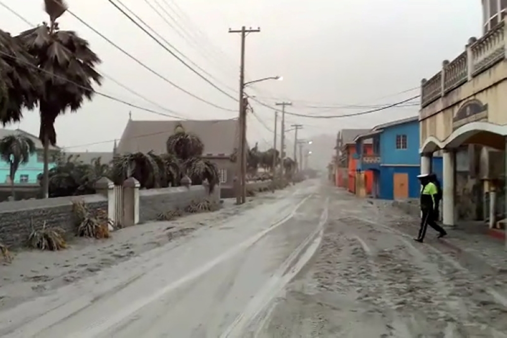 Ash covers roads a day after the La Soufriere volcano erupted after decades of inactivity, about 5 miles (8 km) away in Georgetown, St Vincent and the Grenadines April 10, 2021 in a still image from video. REUTERS/Robertson S. Henry