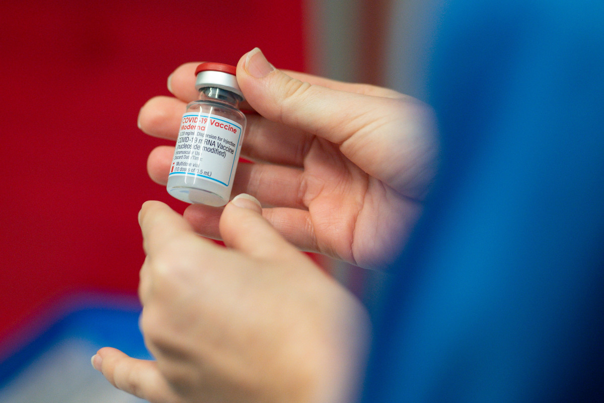 A nurse holds a vial of the Moderna coronavirus disease (COVID-19) vaccine at the Glangwili General Hospital in Carmarthen, Wales, Britain April 7, 2021. Jacob King/Pool via REUTERS
