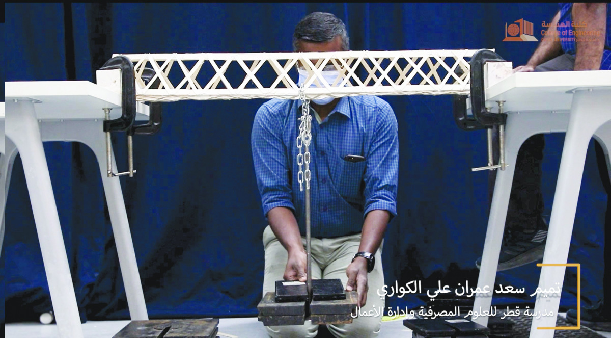 Bridge testing during the 8th High School Wooden Bridge Competition.
