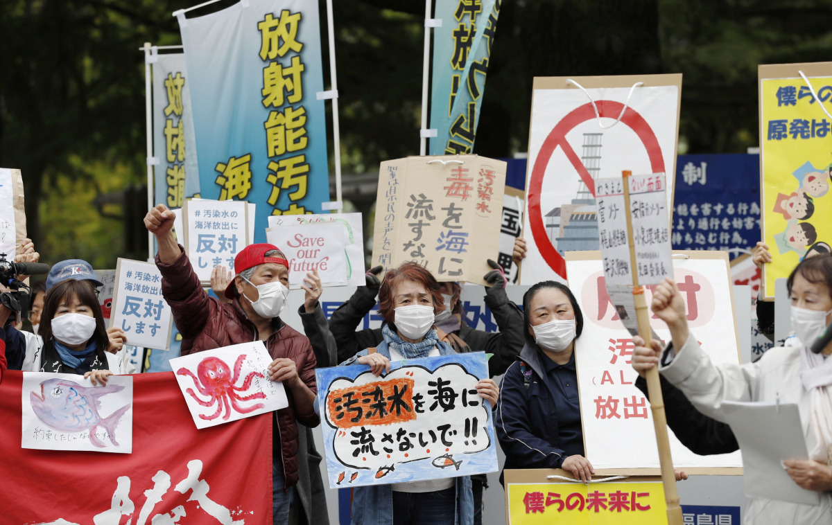 People rally to protest against the Japanese government's decision to discharge contaminated radioactive wastewater from Fukushima Daiichi nuclear power plant into the sea, in front of the Fukushima prefectural government headquarters in Fukushima, April 