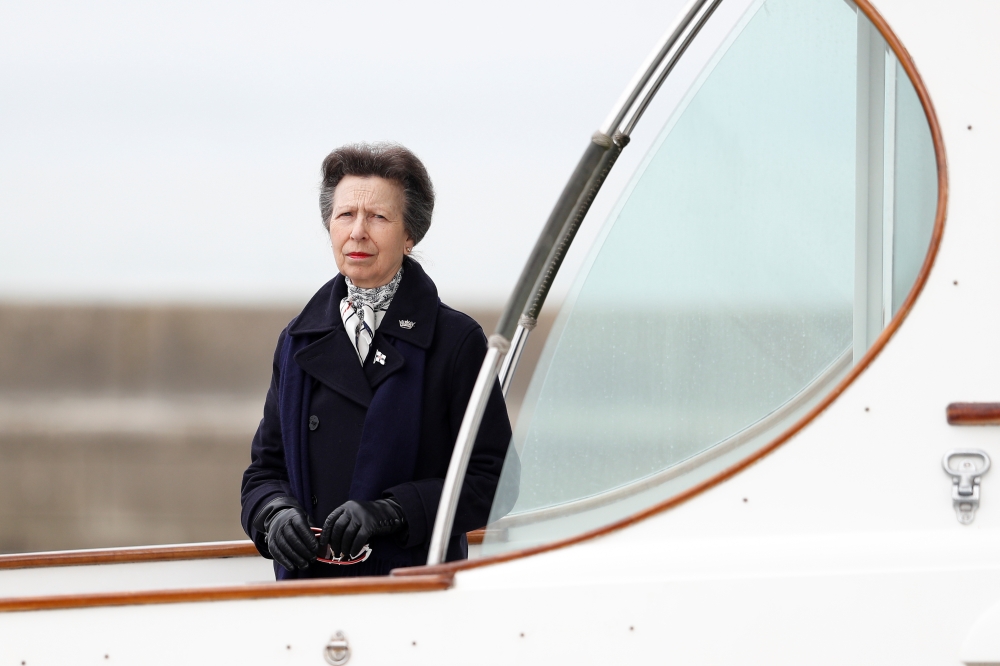 Britain's Princess Anne looks on from the boat at the Royal Yacht Squadron, after Prince Philip, husband of Queen Elizabeth, died at the age of 99, in Cowes on the Isle of Wight, Britain April 14, 2021. REUTERS/Peter Nicholls