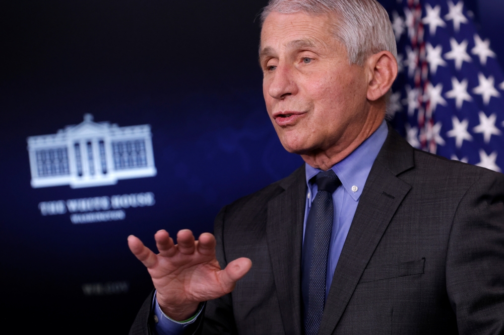 Dr. Anthony Fauci, Director at the National Institute of Allergy and Infectious Diseases, delivers remarks during a press briefing with Press Secretary Jen Psaki at the White House in Washington, U.S., April 13, 2021. REUTERS/Tom Brenner