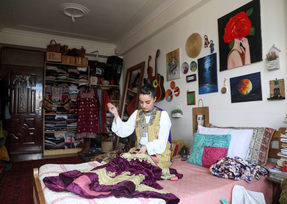 Maryam Yousufi, 25, sews a traditional Afghan design clothing at her home in Kabul, Afghanistan March 8, 2021. Reuters/Omar Sobhani