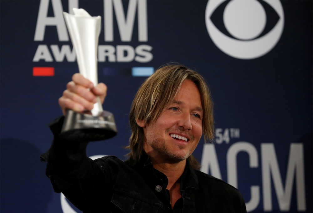 54th Academy of Country Music Awards - Photo Room- Las Vegas, Nevada, U.S., April 7, 2019 - Keith Urban poses backstage with his Entertainer of the Year award. REUTERS/Steve Marcus/File Photo