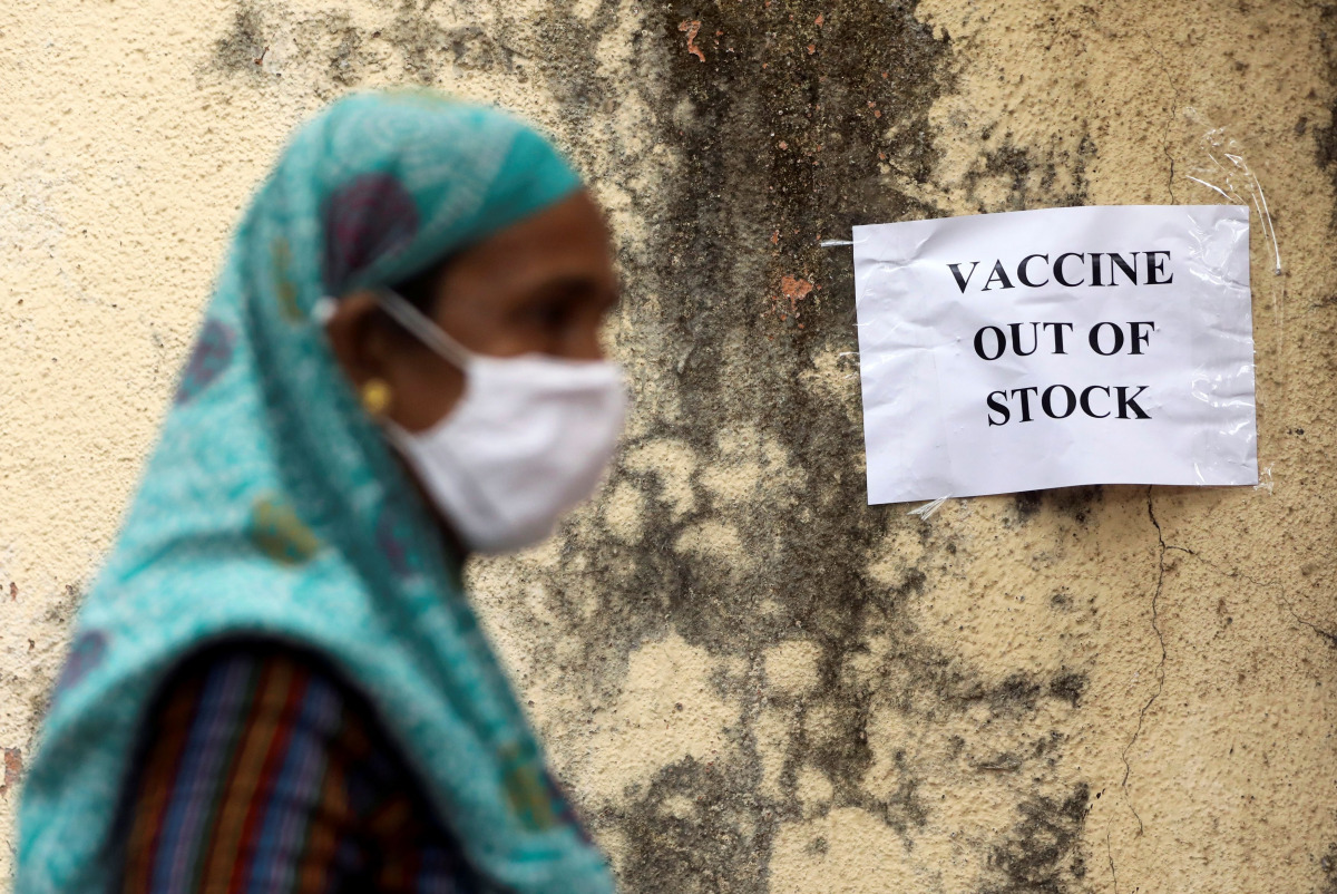 A notice about the shortage of coronavirus disease (COVID-19) vaccine supplies is seen at a vaccination centre, in Mumbai, India, April 8, 2021. REUTERS/Francis Mascarenhas/File photo