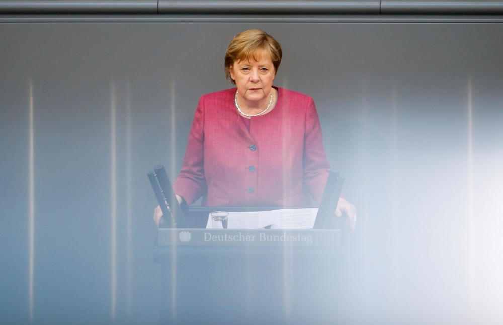 German Chancellor Angela Merkel speaks during a session of the lower house of parliament Bundestag debating the coronavirus disease (COVID-19) measures, in Berlin, Germany, April 16, 2021. REUTERS/Michele Tantussi