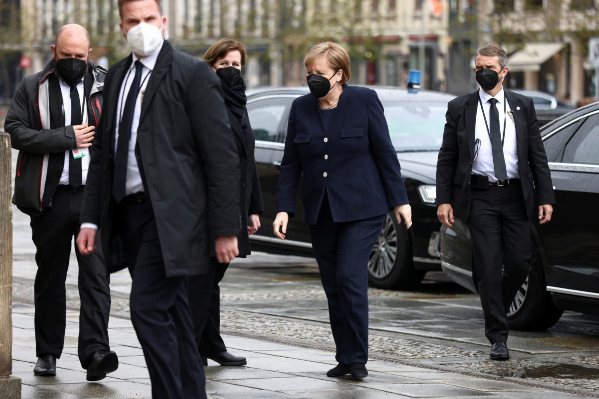 German Chancellor Angela Merkel arrives at Gendarmenmarkt square for a memorial ceremony for the victims of coronavirus disease (COVID-19) pandemic, in Berlin, Germany April 18, 2021. REUTERS/Christian Mang
