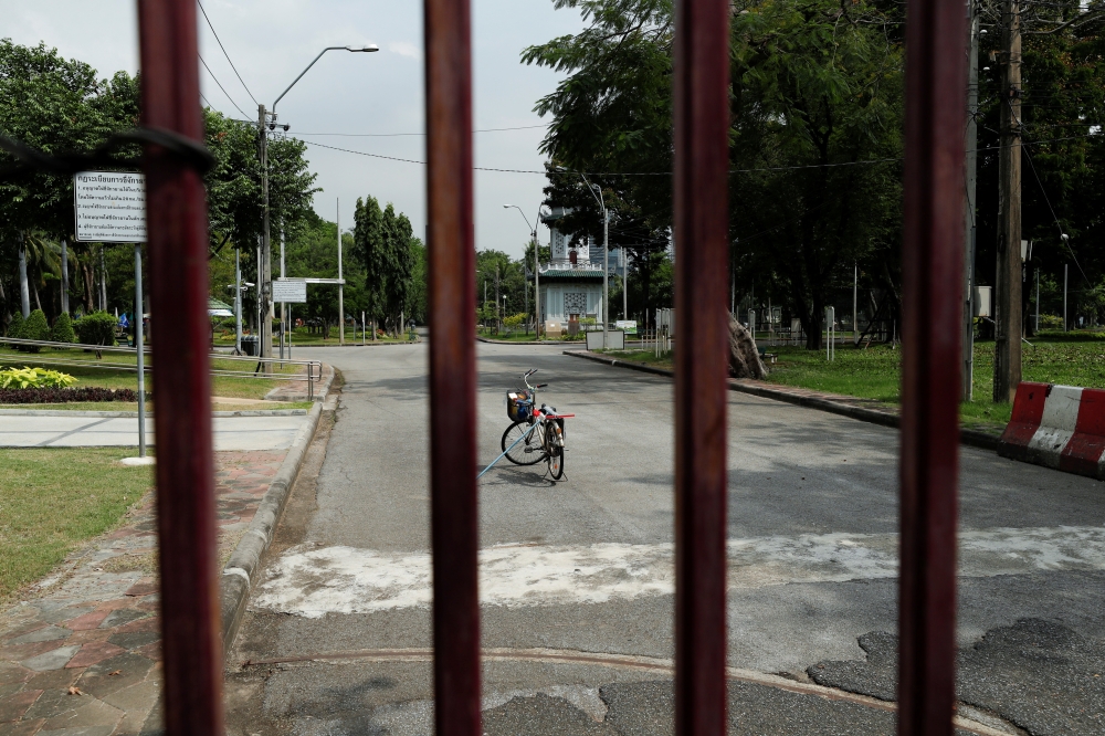 The gates of Lumphini Park are seen closed after Bangkok authorities shut down several entertainment and recreation places to fight the surge of coronavirus disease (COVID-19) cases, in Bangkok, Thailand April 26, 2021. REUTERS/Jorge Silva