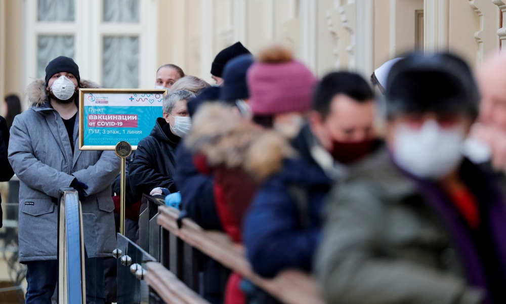 File photo: People line up to receive a dose of Sputnik V (Gam-COVID-Vac) vaccine against the coronavirus disease (COVID-19) at a vaccination centre in the State Department Store, GUM, in central Moscow, Russia January 18, 2021 Reuters/Shamil Zhumatov/Fil