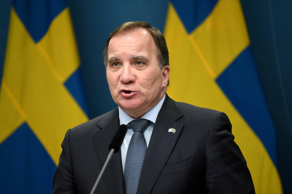 Swedish Prime Minister Stefan Lofven addresses a news conference, after parliament passed a bill giving the government the temporary power to adopt new measures to slow the COVID-19 pandemic, in Stockhom, Sweden January 8, 2021. Fredrik Sandberg/TT News A