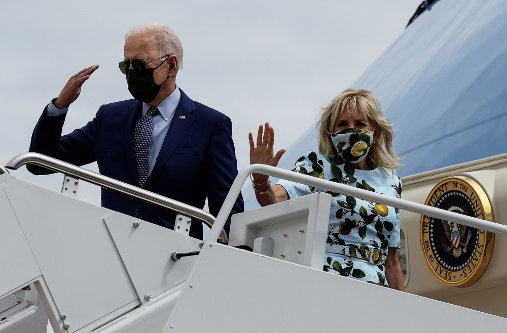 U.S. President Joe Biden boards Air Force One wiith first lady Jill Biden as they depart Washington on travel to Atlanta, Georgia at Joint Base Andrews, Maryland, U.S., Washington, U.S., April 29, 2021. REUTERS/Evelyn Hockstein