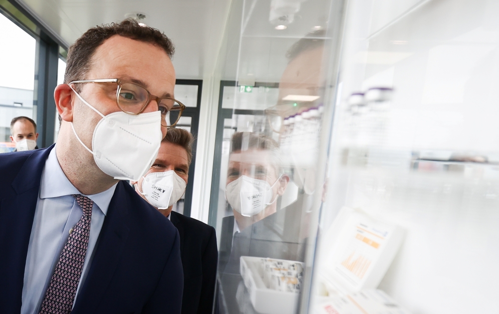 German Health Minister Jens Spahn visits the Allergopharma plant in Reinbek near Hamburg, Germany, April 30, 2021, as the they started the Pfizer/BioNTech Covid-19 vaccine production. Christian Charisius/Pool via REUTERS