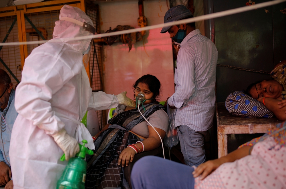 A woman with a breathing problem receives oxygen support for free at a Gurudwara (Sikh temple), amidst the spread of coronavirus disease (COVID-19), in Ghaziabad, India, April 30, 2021. REUTERS/Adnan Abidi