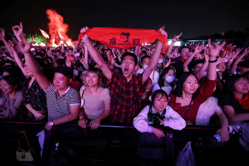 Fans attend a performance of a rock band at the Strawberry Music Festival during Labour Day holiday in Wuhan, Hubei Province, China May 1, 2021. REUTERS/Tingshu Wang