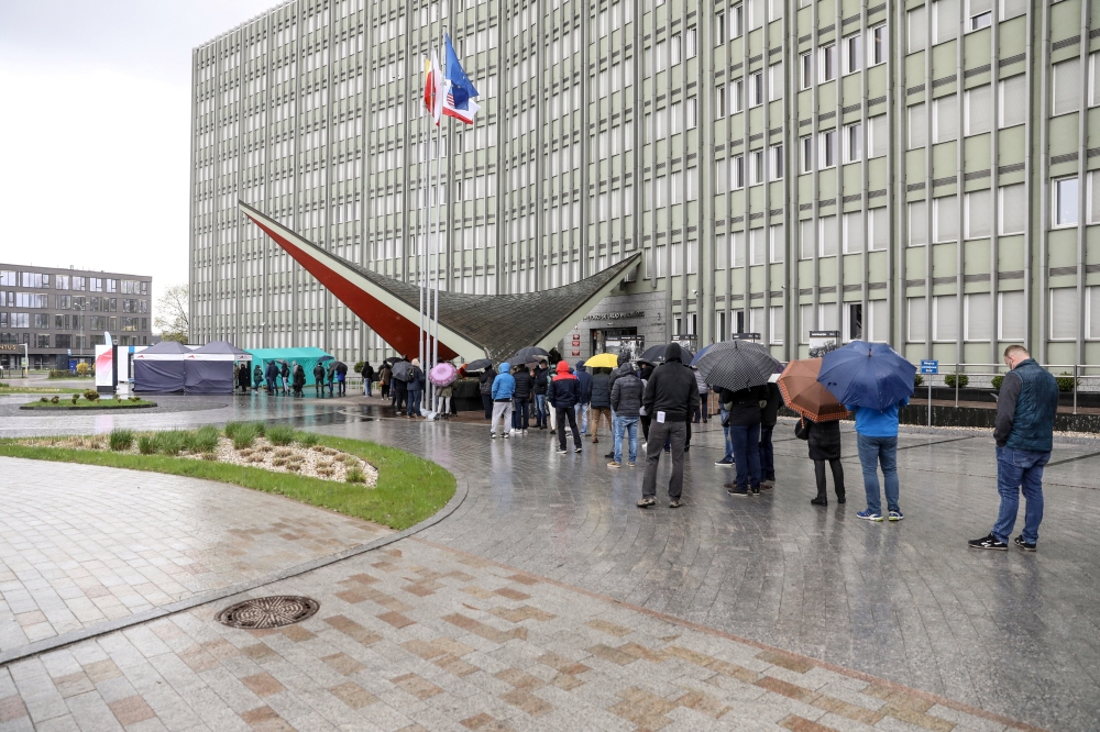 People queue up outside a mass vaccination centre to receive a Johnson & Johnson jab against coronavirus disease (COVID-19) without prior registration during the campaign, 