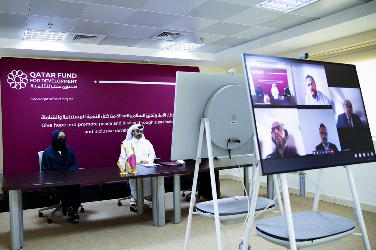 Officials from QFFD, HBKU and GI during the agreement signing ceremony. 