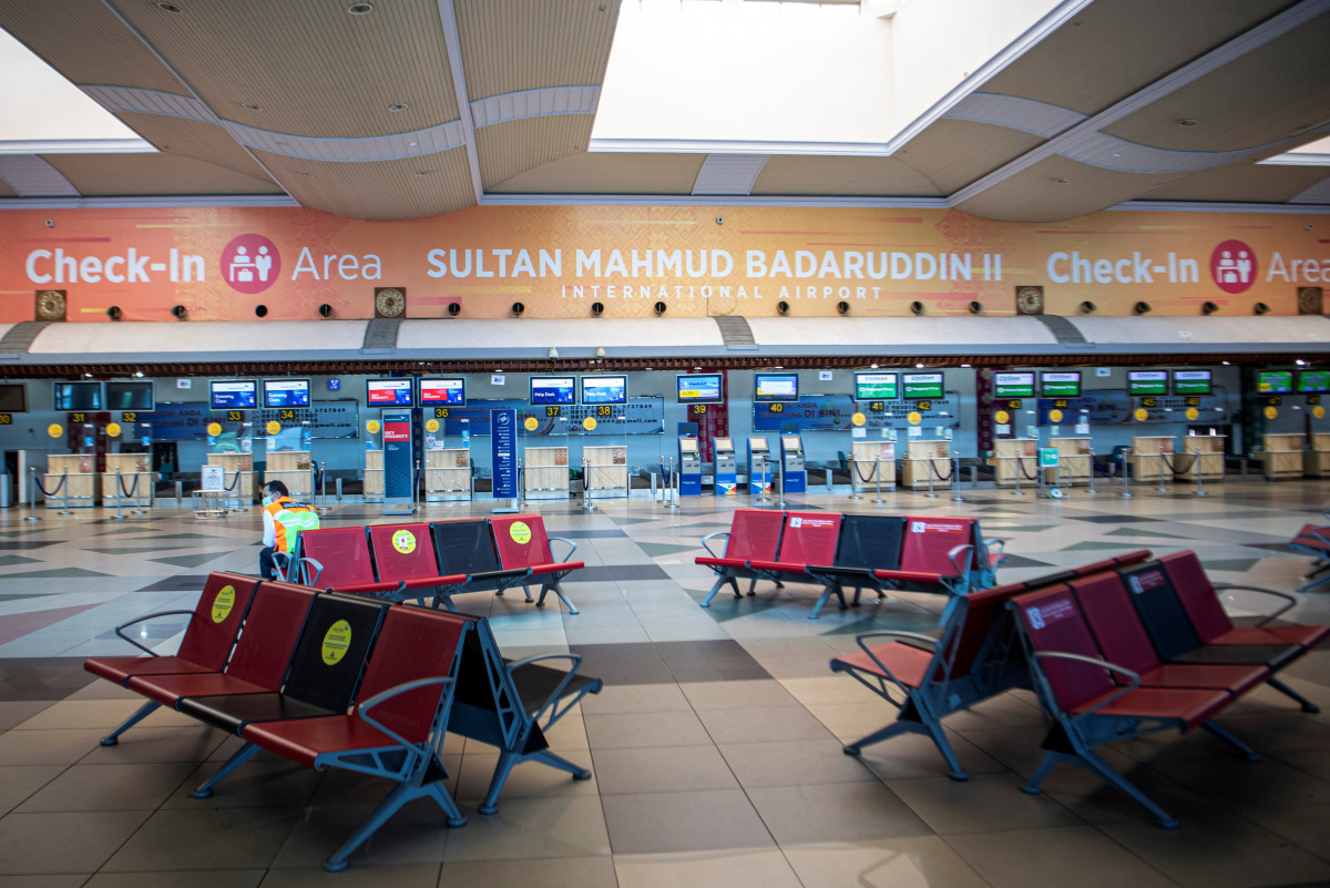 An officer is seen at a departure hall on the first day of a national travel ban as Indonesia halts sea, land, air, and rail travel from May 6 to 17 for the Eid al-Fitr celebrations in an effort to prevent a large-scale transmission of the coronavirus dis