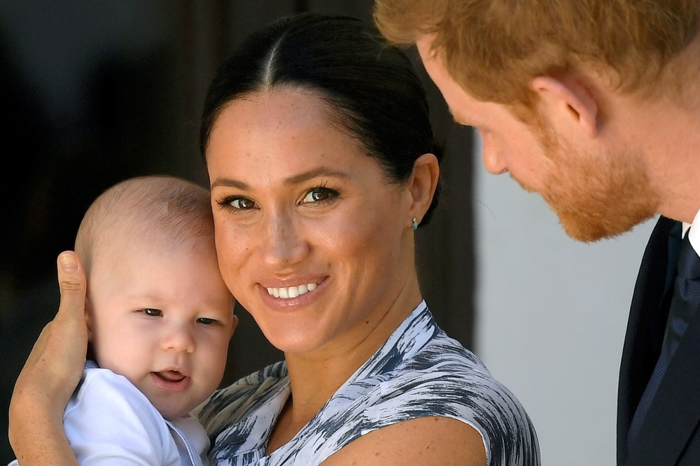Britain's Prince Harry and his wife Meghan, Duchess of Sussex holding their son Archie, meet Archbishop Desmond Tutu (not pictured) at the Desmond & Leah Tutu Legacy Foundation in Cape Town, South Africa, September 25, 2019. REUTERS/Toby Melville/File Pho