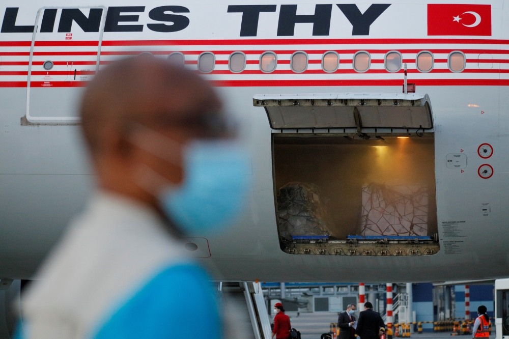 350,000 doses of the Oxford/AstraZeneca coronavirus disease (COVID-19) vaccine, redeployed from the Democratic Republic of Congo, arrive at the Kotoka International Airport in Accra, Ghana, May 7, 2021. REUTERS/Francis Kokoroko