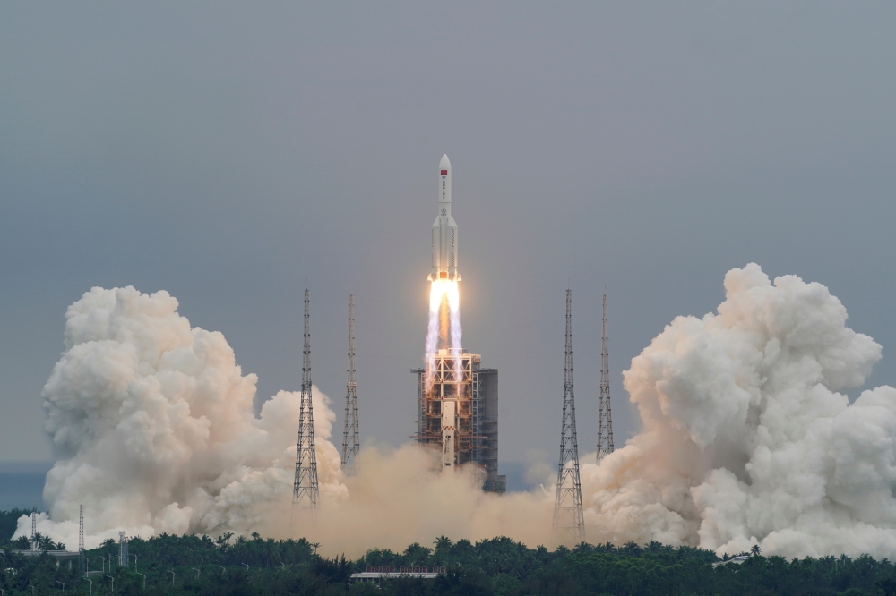 File photo: The Long March-5B Y2 rocket, carrying the core module of China's space station Tianhe, takes off from Wenchang Space Launch Center in Hainan province, China April 29, 2021. China Daily via Reuters 