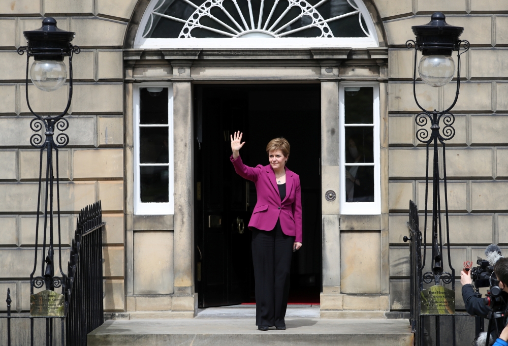 Scotland's First Minister Nicola Sturgeon waves as she arrives at Bute House, in Edinburgh, Scotland, Britain, May 9, 2021. Reuters/Russell Cheyne
